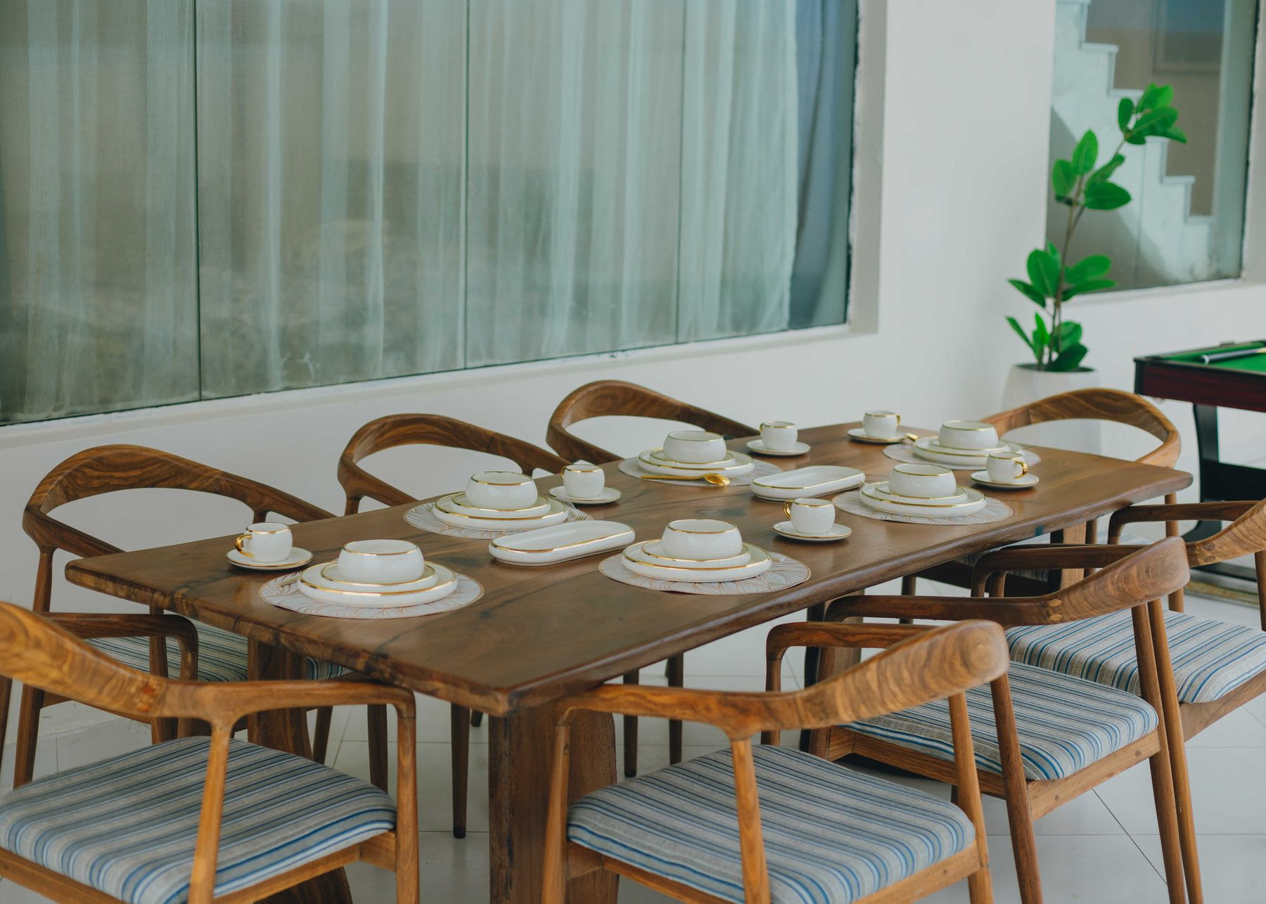 A long table laid for a group on the terrace
